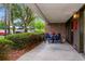 Brick patio with a seating area and garden at 36750 Us 19 N # 03102, Palm Harbor, FL 34684