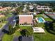 An aerial shot showcases the community clubhouse, pool, tennis, shuffleboard courts, and lush landscaping at 3843 El Poinier W Ct # 8720, Sarasota, FL 34232