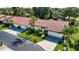Spacious home showcasing a well-manicured lawn, driveway, and tile roof at 3843 El Poinier W Ct # 8720, Sarasota, FL 34232