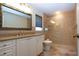 Beautiful bathroom featuring tiled shower with glass door, vanity with granite counters and neutral paint at 3843 El Poinier W Ct # 8720, Sarasota, FL 34232
