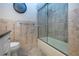 Bathroom featuring shower over tub with glass doors, granite counters, undermount sink and framed mirror at 3843 El Poinier W Ct # 8720, Sarasota, FL 34232