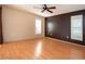 Spacious bedroom with wood floors, neutral walls, and plenty of natural light at 3843 El Poinier W Ct # 8720, Sarasota, FL 34232