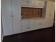Tons of garage storage, including cabinets, workbench, and pegboard for organizing tools at 3843 El Poinier W Ct # 8720, Sarasota, FL 34232