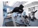 Bright gym with state-of-the-art treadmill, stationary bike, weights, and inspirational wall art at 3843 El Poinier W Ct # 8720, Sarasota, FL 34232