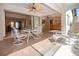 Covered and open air lanai with tile flooring perfect for outdoor seating and relaxing at 3843 El Poinier W Ct # 8720, Sarasota, FL 34232
