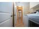 Bright laundry room with tile floors, washer and dryer hookups, and easy access to other areas of the home at 3843 El Poinier W Ct # 8720, Sarasota, FL 34232