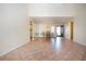 Bright living area featuring tile floors and seamless access to the dining area at 3843 El Poinier W Ct # 8720, Sarasota, FL 34232