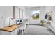 Functional home office with built-in desk, ample natural light, and contemporary decor at 4073 Gold Dust Ln, Sarasota, FL 34243