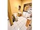 Practical bathroom and laundry area features a standard toilet, sink, and washing machine setup at 4221 26Th W St, Bradenton, FL 34205