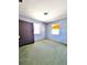 Modest bedroom featuring two windows and showing green carpet throughout at 4221 26Th W St, Bradenton, FL 34205
