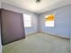 Modest bedroom featuring two windows and showing green carpet throughout at 4221 26Th W St, Bradenton, FL 34205