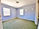Modest bedroom featuring two windows and showing green carpet throughout at 4221 26Th W St, Bradenton, FL 34205