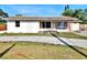 View of single-story home with large windows and a front lawn needing landscaping at 4221 26Th W St, Bradenton, FL 34205