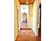 Hallway with tiled flooring leading to other rooms, visible exit sign at 4221 26Th W St, Bradenton, FL 34205