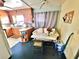 Functional kitchen features wooden cabinetry and a cozy dining area with seating at 4221 26Th W St, Bradenton, FL 34205