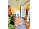 Comfortable living room featuring tile flooring, a black sofa, and natural light at 4221 26Th W St, Bradenton, FL 34205