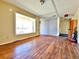 Spacious living room features hardwood floors, large window, and an exit sign above a door at 4221 26Th W St, Bradenton, FL 34205