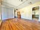 Hardwood floors accent the spacious living room; exit sign above a door at 4221 26Th W St, Bradenton, FL 34205