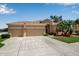 Well-maintained home with a two-car garage, expansive driveway, and manicured landscaping, creating a welcoming exterior at 4706 Josselin Pl, Parrish, FL 34219