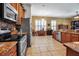 Spacious kitchen with stainless steel appliances and granite countertops at 4706 Josselin Pl, Parrish, FL 34219