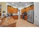 Functional kitchen with wooden cabinets, granite countertops, and stainless steel appliances at 4706 Josselin Pl, Parrish, FL 34219
