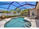 Enclosed pool area featuring refreshing blue water, comfortable seating, and a peaceful outdoor setting at 4706 Josselin Pl, Parrish, FL 34219