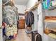 Walk-in closet with ample storage, including shelving and hanging space at 4706 Josselin Pl, Parrish, FL 34219