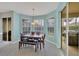 Cozy breakfast nook with bright windows, a dining table, and patio access at 5106 Far Oak Cir, Sarasota, FL 34238