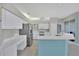 Bright kitchen featuring stainless steel appliances, stone countertops, and tiled floors at 5106 Far Oak Cir, Sarasota, FL 34238