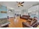 Bright open living room with hardwood floors and views of the office and kitchen at 5106 Far Oak Cir, Sarasota, FL 34238