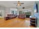 This living room showcases an open floor plan, hardwood floors, and a sliding glass door at 5106 Far Oak Cir, Sarasota, FL 34238
