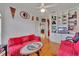 Charming living room with hardwood floors, custom shelving, and comfortable seating at 5106 Far Oak Cir, Sarasota, FL 34238