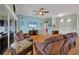 Inviting living room with hardwood floors, ceiling fan, and comfortable brown sofas at 5106 Far Oak Cir, Sarasota, FL 34238