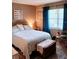 Inviting bedroom with a comfortable bed, accent chair, and natural light from the window at 5400 26Th W St # F104, Bradenton, FL 34207