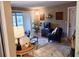 Cozy living room with tile floors, neutral walls, and comfortable seating arrangement at 5400 26Th W St # F104, Bradenton, FL 34207