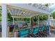 Outdoor kitchen with granite countertops and seating near community pool at 5400 26Th W St # F104, Bradenton, FL 34207