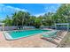 Inviting community swimming pool surrounded by lounge chairs and lush tropical landscaping at 5400 26Th W St # F104, Bradenton, FL 34207