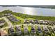 Aerial view of waterfront community with lush lawns and docks at 5402 Tidewater Preserve Blvd, Bradenton, FL 34208