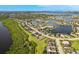 Beautiful aerial view of waterfront homes, lush landscaping, and serene community lakes at 5402 Tidewater Preserve Blvd, Bradenton, FL 34208