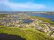 Stunning aerial view of a waterfront community with lush greenery and blue waterways at 5402 Tidewater Preserve Blvd, Bradenton, FL 34208