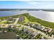 Picturesque waterfront community features beautiful homes, lush greenery, and direct water access at 5402 Tidewater Preserve Blvd, Bradenton, FL 34208