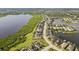 Scenic aerial view of waterfront homes bordering a lush green conservation area at 5402 Tidewater Preserve Blvd, Bradenton, FL 34208