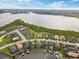 Stunning aerial view of waterfront property with lush landscaping, in a serene community at 5402 Tidewater Preserve Blvd, Bradenton, FL 34208