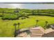 Expansive backyard features a screened-in pool with conservation views and mature palm trees at 5402 Tidewater Preserve Blvd, Bradenton, FL 34208