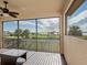 Enjoy the view from this balcony overlooking the water, palm trees, and manicured greenery at 5402 Tidewater Preserve Blvd, Bradenton, FL 34208