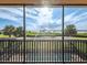 Enjoy scenic views from this balcony, with the ocean and tropical greenery offering a serene escape at 5402 Tidewater Preserve Blvd, Bradenton, FL 34208