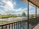 Breathtaking balcony view featuring palm trees, waterway, and a screened-in pool area for relaxed outdoor living at 5402 Tidewater Preserve Blvd, Bradenton, FL 34208