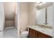 Well-lit bathroom featuring granite counters, tile floors, and a storage area creating a functional and stylish space at 5402 Tidewater Preserve Blvd, Bradenton, FL 34208