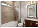 A bathroom features a tile shower and a granite vanity at 5402 Tidewater Preserve Blvd, Bradenton, FL 34208