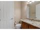 Neutral powder room with a decorative granite vanity and white fixtures at 5402 Tidewater Preserve Blvd, Bradenton, FL 34208